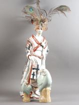 An Imari porcelain figure of a woman with replacement head, 20 1/2" high, two Chinese celadon glazed