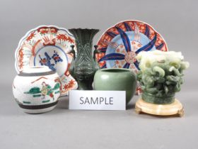 Two Chinese Imari plates, a Chinese polychrome ginger jar, a crackled glazed jar, a bronzed vase,