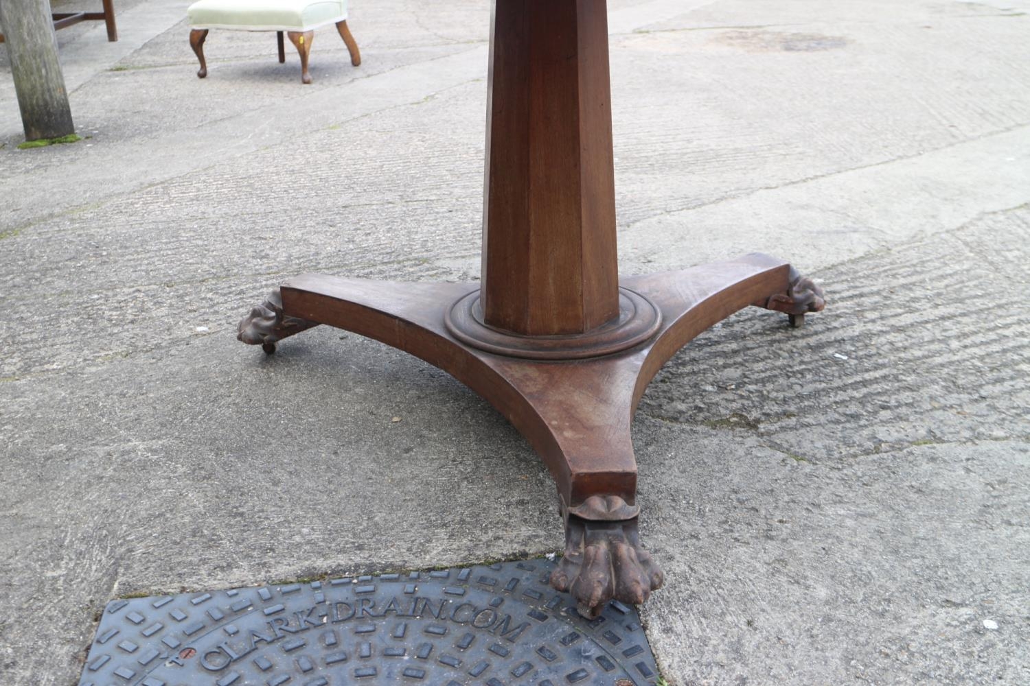 A mid Victorian mahogany circular tilt top dining table, on faceted column, triform base and lion - Image 2 of 4