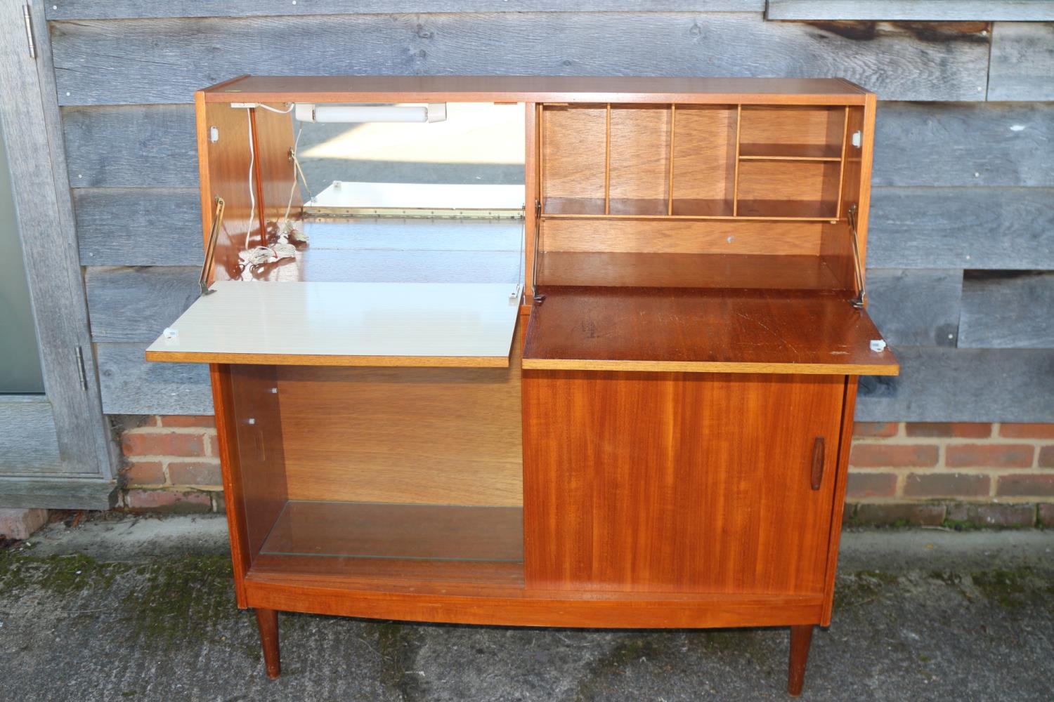 A 1960s Doncraft teak desk/cocktail cabinet with two fall front compartments over one glass and - Image 2 of 4