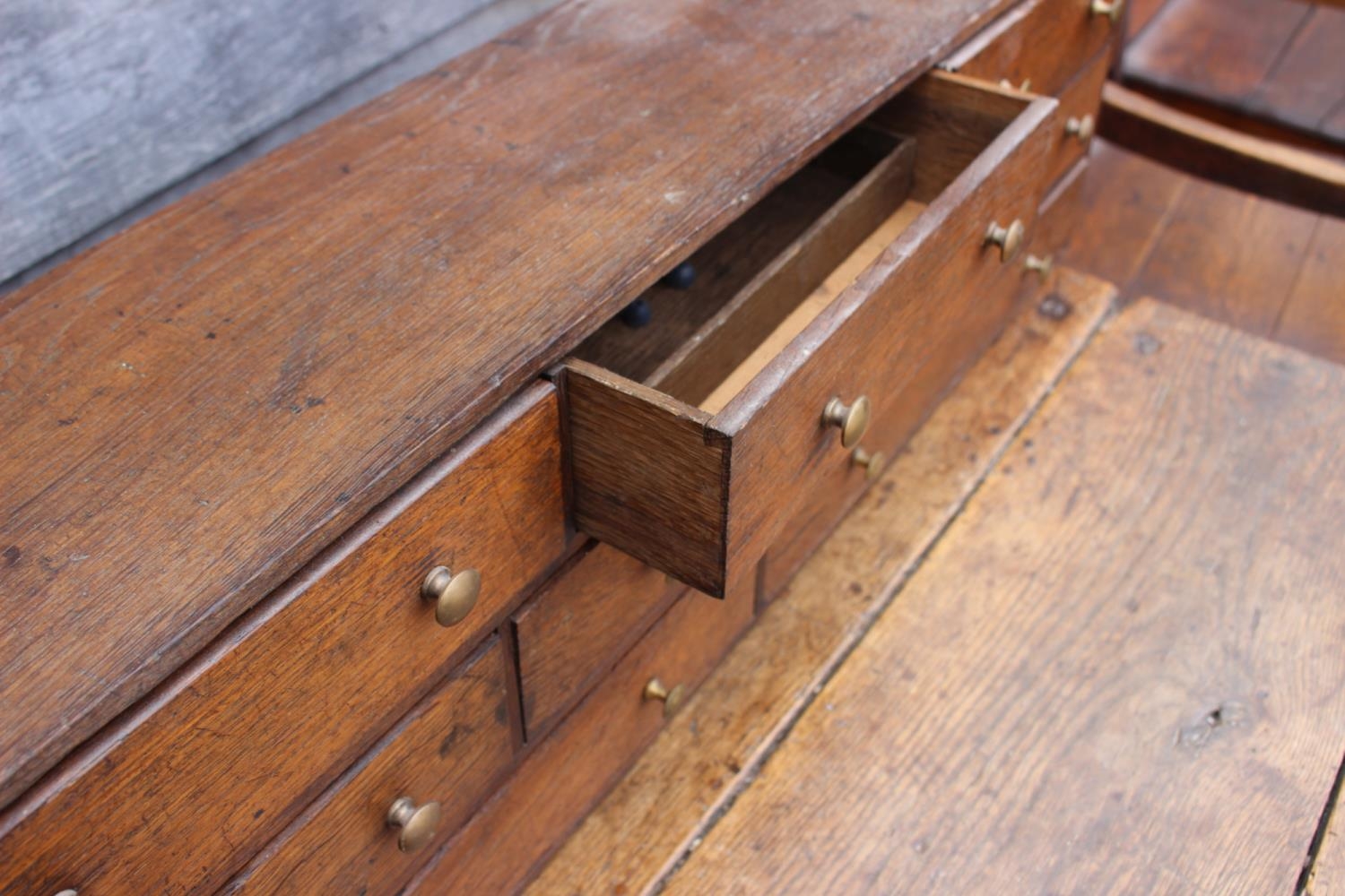 An oak table top nest of eight drawers with brass knob handles, 33 1/4" wide x 7" deep x 9 3/4" high - Image 2 of 2