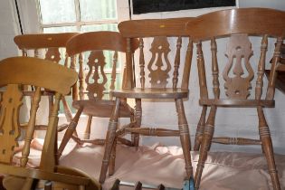 An oak dining table, on turned supports, 48" wide x 29 1/2" deep x 28 1/2" high, and four oak