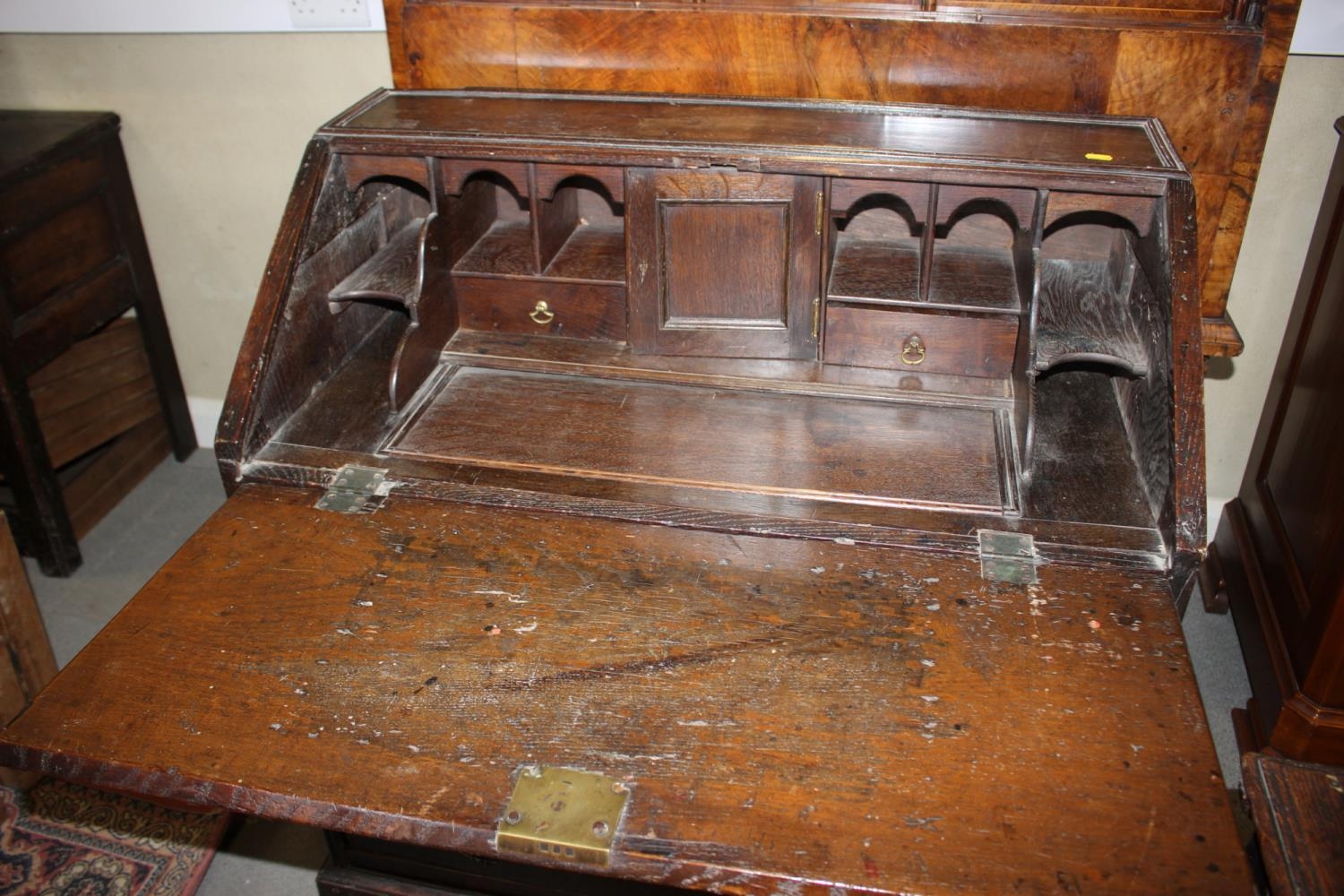 An early 18th century fall front bureau with fitted interior cupboard and well over two short and - Image 2 of 3