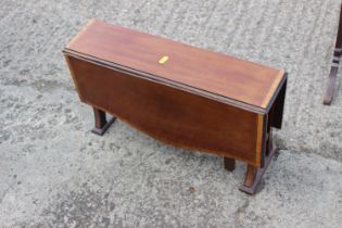 An Edwardian walnut and satinwood banded Sutherland table,  21" wide x 12" high (cut down), a larger