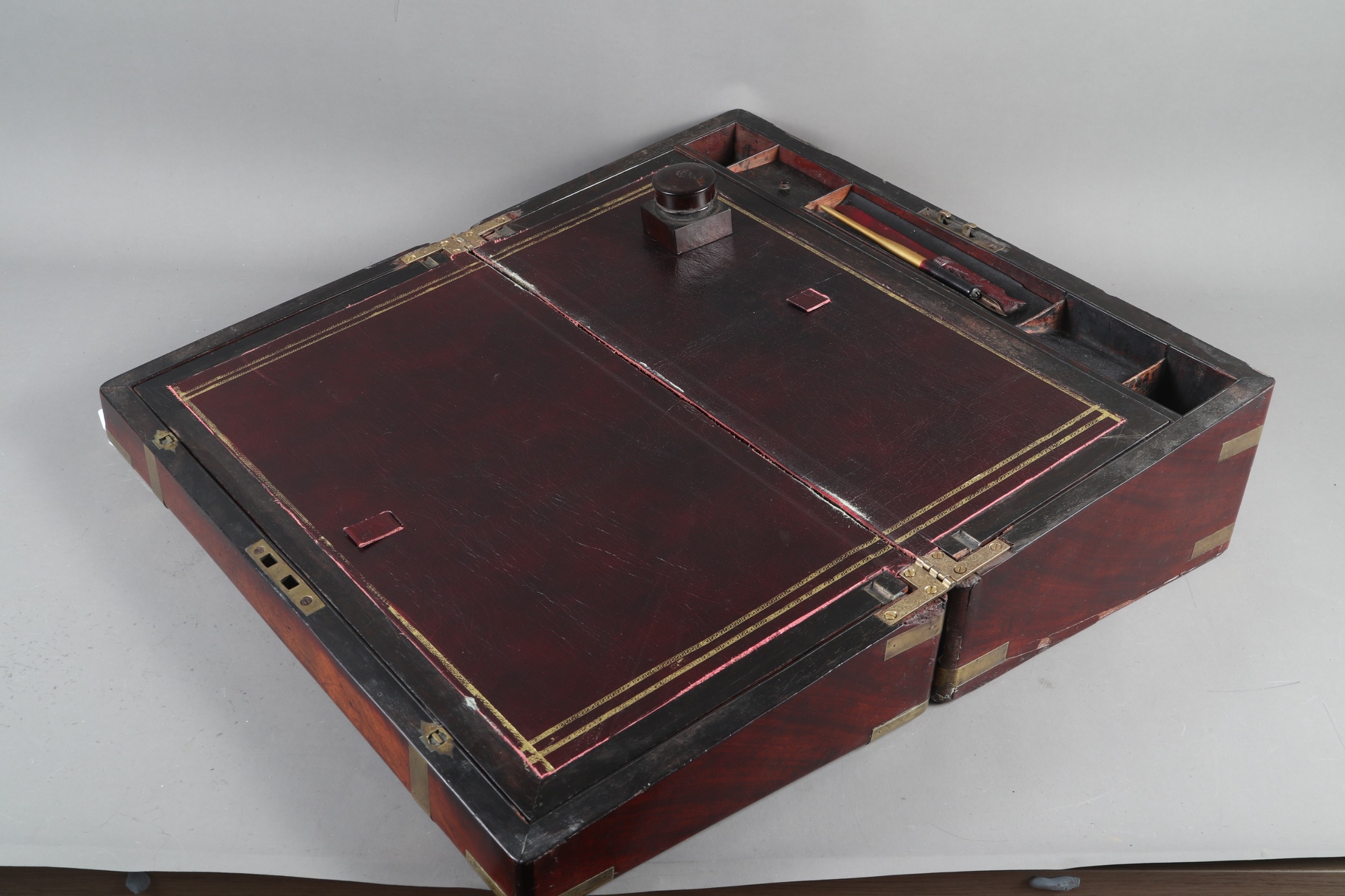 A 19th century mahogany and brass mounted writing box with fitted interior, secret drawers and