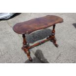 A late 19th century burr walnut shape top occasional table, on turned and splayed supports, 42" wide