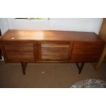 A 1960s McIntosh teak sideboard, fitted three drawers and two slatted front doors, on shaped