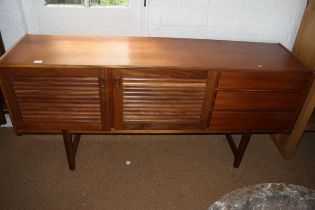 A 1960s McIntosh teak sideboard, fitted three drawers and two slatted front doors, on shaped