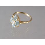 An 18ct gold diamond and aquamarine dress ring, size P, 3.4g