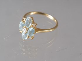 An 18ct gold diamond and aquamarine dress ring, size P, 3.4g