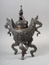 A Chinese bronze censer, decorated clouds, with elephant finial, 10" high