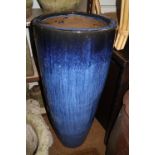 A blue glazed cylindrical planter, 15" dia x 35" high