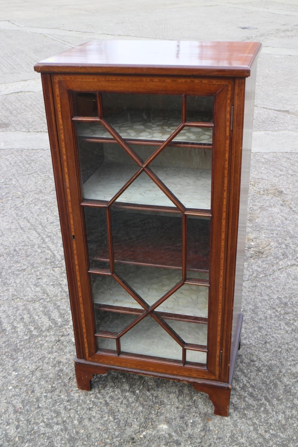 A mahogany astragal glazed display cabinet, fitted one door and four shelves, 19" wide x 13 1/2"