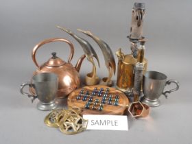 A brass blow torch, a copper kettle, various reproduction horse brasses, four pewter mugs, a