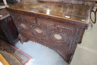 An early 18th century Syrian chip carved walnut and mother-of-pearl inlaid coffer chest with panel