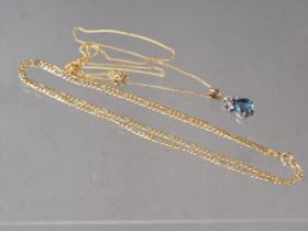 A diamond and blue stone pendant on fine 9ct gold chain, 2.2g, and a 9ct gold flat link necklace,