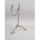 An antique wrought iron rush light holder, 11 1/4" high