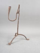 An antique wrought iron rush light holder, 11 1/4" high