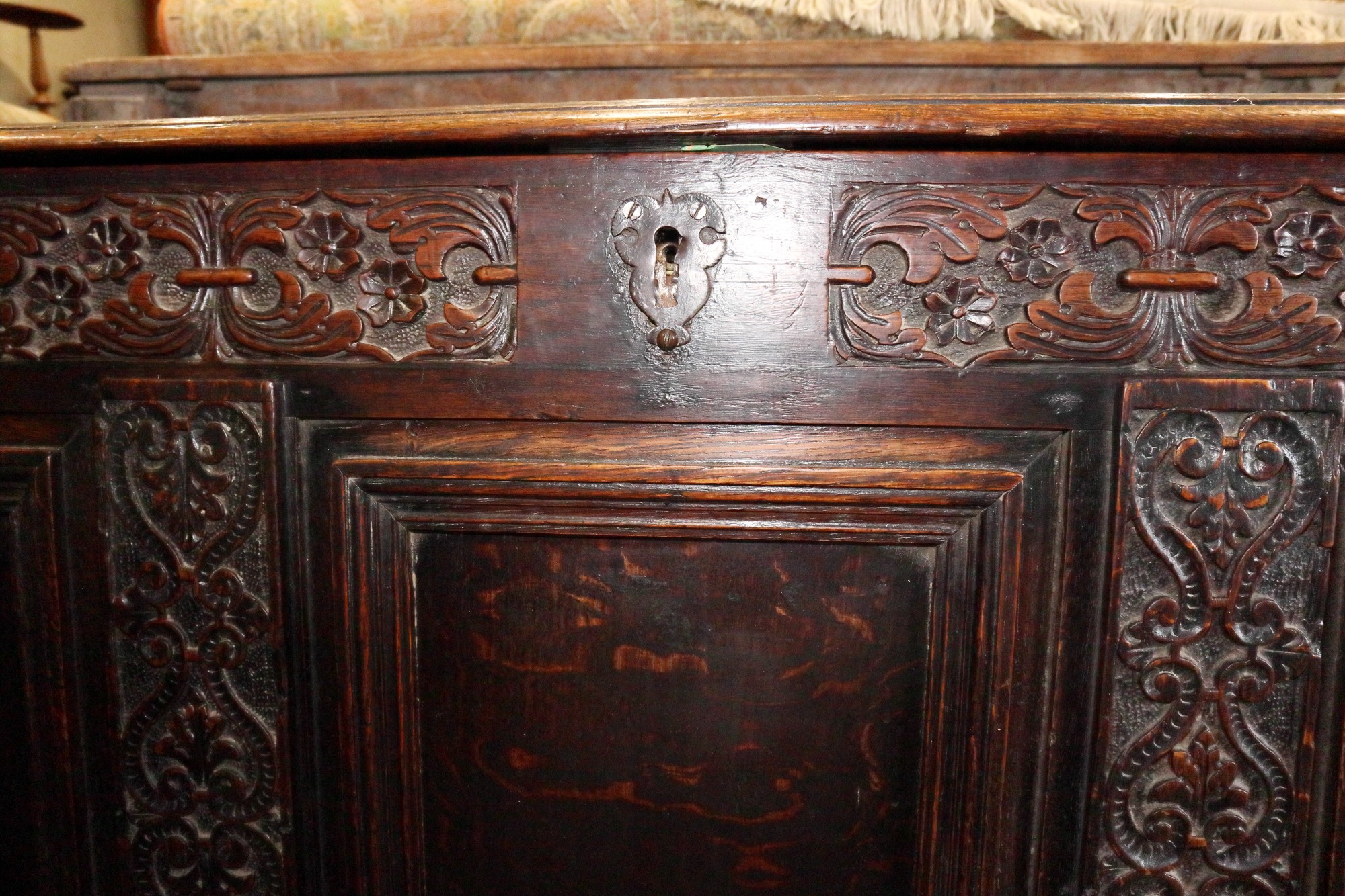 An early 18th century carved oak triple panel front coffer with scroll design and planked top, on - Image 3 of 5