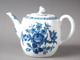 An 18th century Worcester porcelain drum teapot with floral decoration, 4" high (chips to spout,