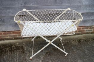 A child's early 19th century white painted folding metal travelling cot (for ornamental use only)