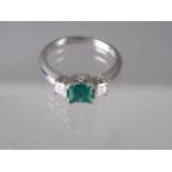 An Art Deco style 18ct white gold emerald and diamond ring, size O/P, 6.3g