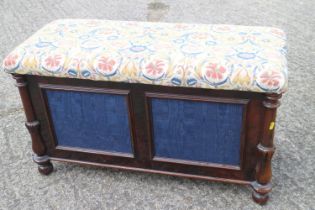 A Regency rosewood box seat ottoman with fabric panels, on turned and castored supports, 34" wide