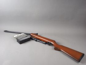 A BSA Meteor .22 calibre spring action air rifle, 41 1/4" long, with pellets and telescopic sight