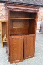 A walnut TV cabinet enclosed two doors over fall front compartment, on shaped bracket feet, 38" wide