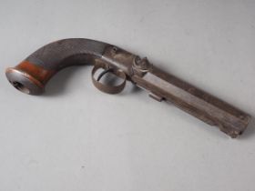 A 19th century percussion cap pistol with octagonal barrel and engraved walnut handle, 9" long
