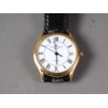 A gentleman's 18ct gold cased Baume & Mercier wristwatch with white enamel dial and Roman