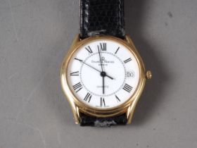A gentleman's 18ct gold cased Baume & Mercier wristwatch with white enamel dial and Roman