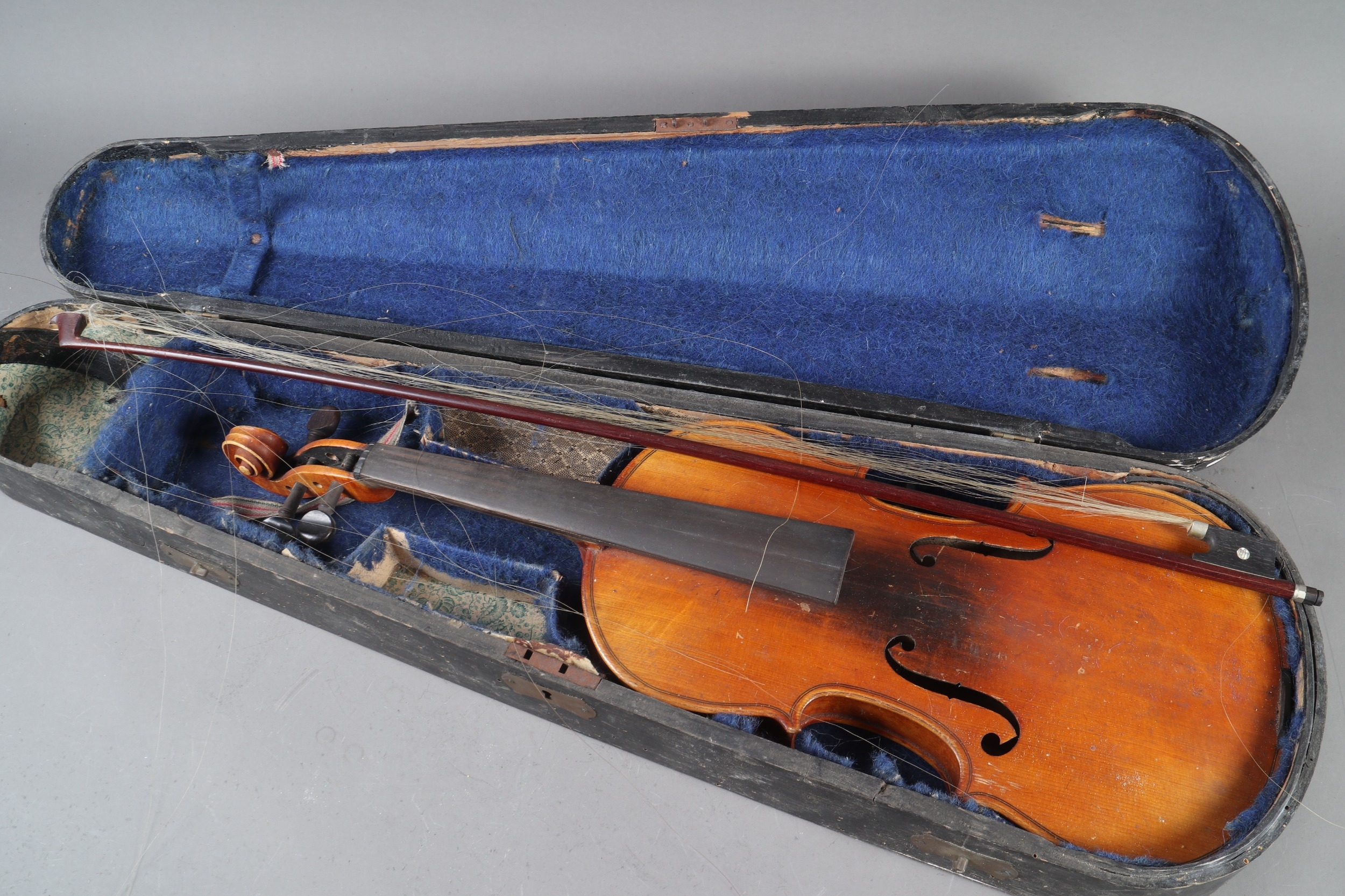 A student's violin and bow, in a wooden case, Violin is 23" long