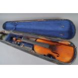 A student's violin and bow, in a wooden case, Violin is 23" long