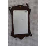 A walnut framed wall mirror of early 18th century design with crest, 20 1/2" high (for restoration)