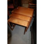 A nest of three G Plan teak occasional tables, largest 21" wide x 17" deep x 19" high, and a similar
