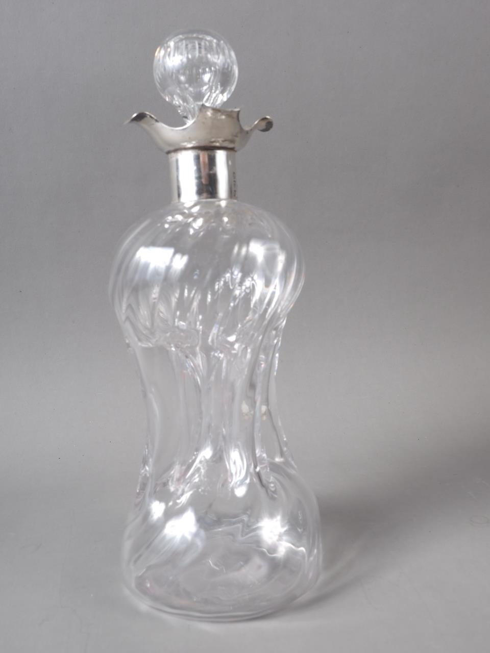 A Victorian blown glass "glug glug" decanter with silver collar, 10" high