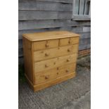 A waxed pine chest of two short and three long drawers with knob handles, on block base, 41" wide