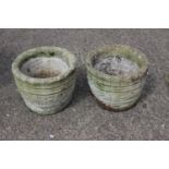 A pair of cast stone "coopered" planters with floral decoration, 14" dia