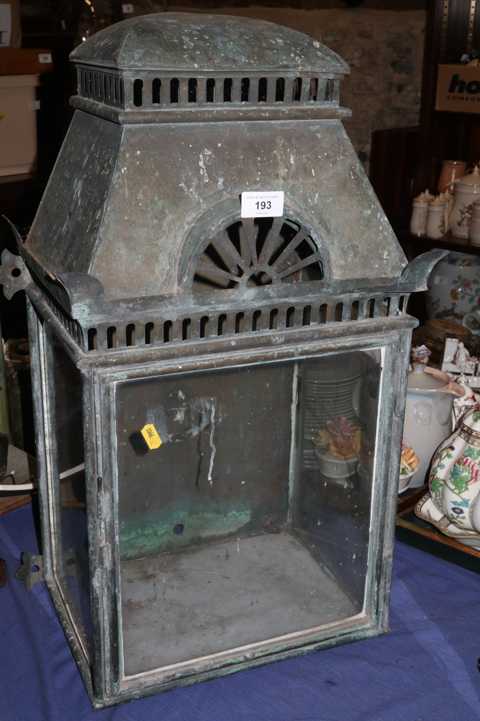 A 19th century brass and glass fronted lantern case with pierced decoration (one glass panel