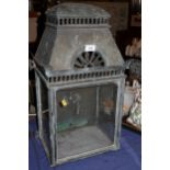 A 19th century brass and glass fronted lantern case with pierced decoration (one glass panel