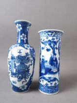 A Chinese blue and white baluster vase with panelled precious object decoration on a floral