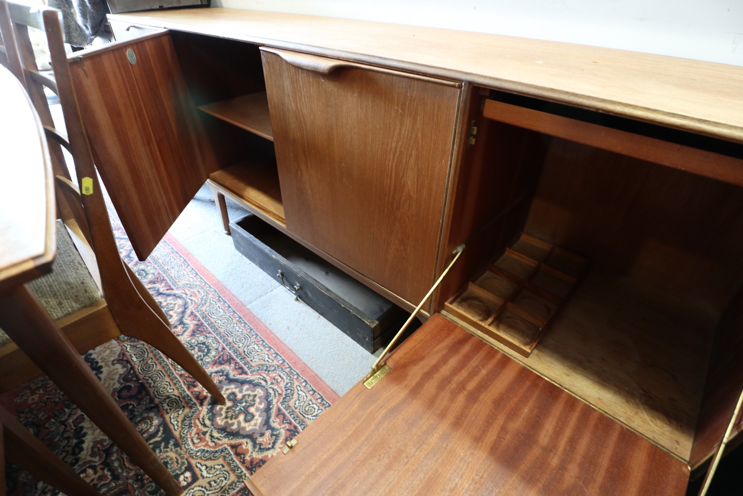 A 1960s McIntosh sideboard, fitted three drawers and three doors enclosed shelves, cellarette and - Image 2 of 6