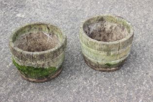 A pair of cast stone "coopered" planters, 12" dia