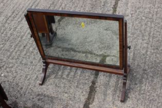 A 19th century mahogany swing frame toilet mirror, on skeleton stand, 23" wide x 19" high