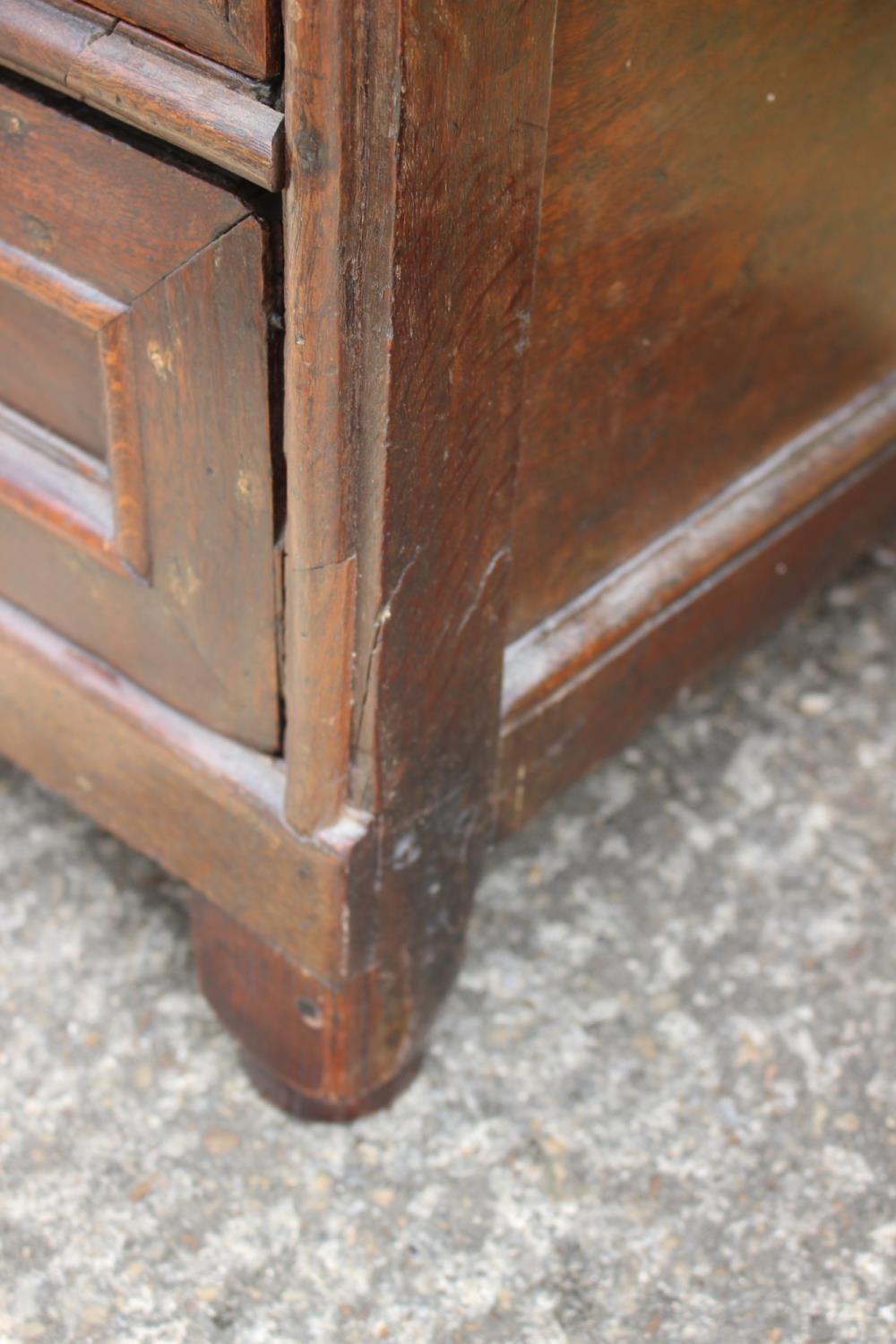 An 18th century oak panelled front chest fitted two short and two long drawers with brass knob - Image 4 of 4