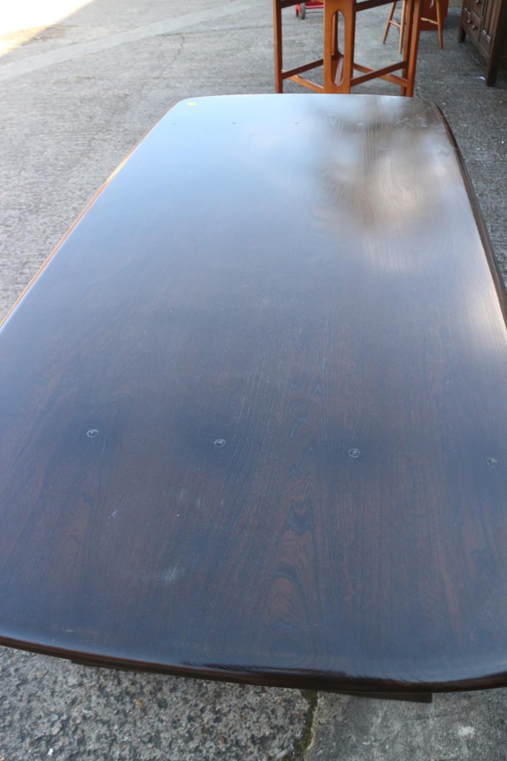 An Ercol dark elm Old Colonial refectory type fixed top dining table, on pierced panel end supports, - Image 3 of 3