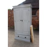 A 19th century French armoire enclosed two panelled doors, on square taper supports, 49" wide x