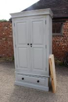 A 19th century French armoire enclosed two panelled doors, on square taper supports, 49" wide x