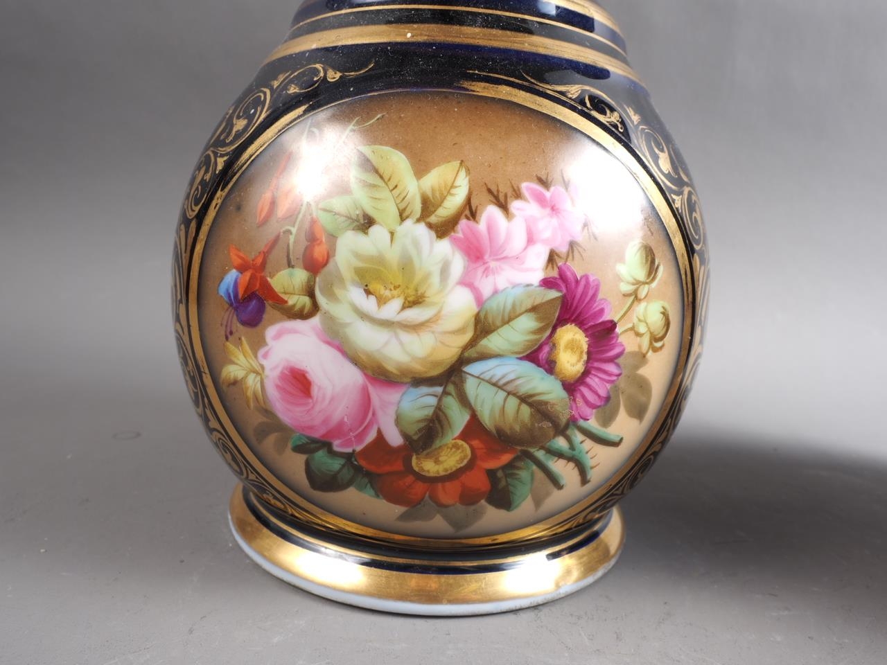 A pair of early 19th century bone china vases with flared rims and floral reserve panels on a blue - Image 4 of 16